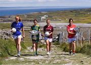 13 July 2017; Stars of the TG4 All Ireland Championships assembled at the famous Dún Aengus on Inis Mór in the Aran Islands to launch the 2017 TG4 All Ireland Championships. The championship gets underway when the preliminary rounds take place on July 22nd as 36 counties begin the journey that will take them to Croke Park on September 24th. TG4 also announced their search for the #properfan that will take place throughout the 2017 TG4 All Ireland Champinships. Pictured are, from left, ladies footballers Aishling Moloney of Tipperary, Niamh O'Sullivan of Meath, Sinead Burke of Galway, and Ciara O'Sullivan of Cork, at Dún Aengus, Inis Mór, Aran Islands, Co. Galway.  Photo by Seb Daly/Sportsfile