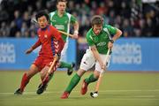 13 March 2012; Ian Sloan, Ireland, in action against Seong Eun Hong, Korea. Men’s 2012 Olympic Qualifying Tournament, Ireland v Korea. National Hockey Stadium, UCD, Belfield, Dublin. Picture credit: Barry Cregg / SPORTSFILE