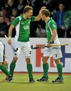 13 March 2012; David Ames, left, Ireland, celebrates with team-mate Michael Watt after he scored his side's first goal. Men’s 2012 Olympic Qualifying Tournament, Ireland v Korea. National Hockey Stadium, UCD, Belfield, Dublin. Picture credit: Barry Cregg / SPORTSFILE