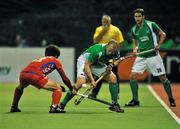 13 March 2012; Eugene Magee, Ireland, with support from team-mate Paul Cleghorne, in action against Woo Hyun Nam, Korea. Men’s 2012 Olympic Qualifying Tournament, Ireland v Korea. National Hockey Stadium, UCD, Belfield, Dublin. Picture credit: Barry Cregg / SPORTSFILE