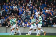 14 July 2017; Linfield supporters look on as Tom Rogic of Celtic celebrates with team-mates after scoring his side's second goal during the UEFA Champions League Second Qualifying Round First Leg match between Linfield and Glasgow Celtic at the National Football Stadium in Windsor Park, Belfast. Photo by David Fitzgerald/Sportsfile