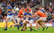15 July 2017; Bill Maher of Tipperary in action against, from left, Niall Grimley, Paul Hughes and Stephen Sheridan of Armagh during the GAA Football All-Ireland Senior Championship Round 3B match between Tipperary and Armagh at Semple Stadium in Thurles, Co Tipperary. Photo by Ray McManus/Sportsfile