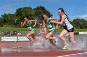 15 July 2017; Competitors, from left, Roisin Treacy of St Gerard's Bray, Co Wicklow, Alannah Neff of Carrigaline CS, Co Cork, both representing Ireland, and Sarah Tait of Firrhill High School, Edinburgh, representing Scotland, during the Girls 1500m steeplechase event during the SIAB T&F Championships at Morton Stadium in Santry, Co. Dublin. Photo by Piaras Ó Mídheach/Sportsfile