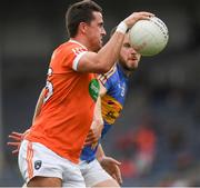 15 July 2017; Stefan Campbell of Armagh races past Paddy Codd of Tipperary on his way to score his side's 16th point during the GAA Football All-Ireland Senior Championship Round 3B match between Tipperary and Armagh at Semple Stadium in Thurles, Co Tipperary. Photo by Ray McManus/Sportsfile