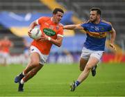 15 July 2017; Stefan Campbell of Armagh races past Paddy Codd of Tipperary  on his way to score his side's 16th point during the GAA Football All-Ireland Senior Championship Round 3B match between Tipperary and Armagh at Semple Stadium in Thurles, Co Tipperary. Photo by Ray McManus/Sportsfile