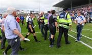 15 July 2017; Referee Paddy Neilan is escorted off the pitch by Gardai and stadium officials after the GAA Football All-Ireland Senior Championship Round 3B match between Tipperary and Armagh at Semple Stadium in Thurles, Co Tipperary. Photo by Ray McManus/Sportsfile