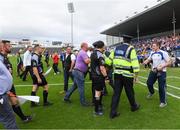 15 July 2017; Referee Paddy Neilan is escorted off the pitch by Gardai and stadium officials after the GAA Football All-Ireland Senior Championship Round 3B match between Tipperary and Armagh at Semple Stadium in Thurles, Co Tipperary. Photo by Ray McManus/Sportsfile