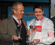 14 March 2012; Jockey Barry Geraghty with winning owner Michael Buckley after Finian's Rainbow won the sportingbet.com Queen Mother Champion Steeple Chase. Cheltenham Racing Festival, Prestbury Park, Cheltenham, England. Picture credit: Brendan Moran / SPORTSFILE
