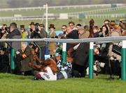 14 March 2012; Jockey Richard Johnson is unseated by his mount Wishful Thinking as they crash into a number of photographers and trackside personnel after they had jumped the 'last first time round' during the sportingbet.com Queen Mother Champion Steeple Chase. Cheltenham Racing Festival, Prestbury Park, Cheltenham, England. Picture credit: Brendan Moran / SPORTSFILE