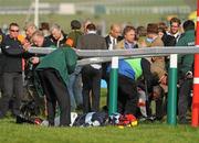 14 March 2012; Jockey Richard Johnson after he was unseated by his mount Wishful Thinking and crashed into a number of photographers and trackside personnel after they had jumped the 'last first time round' during the sportingbet.com Queen Mother Champion Steeple Chase. Cheltenham Racing Festival, Prestbury Park, Cheltenham, England. Picture credit: Brendan Moran / SPORTSFILE