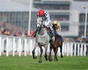 14 March 2012; Simonsig, with Barry Geraghty up, on the way to winning the Neptune Investment Management Novices' Hurdle. Cheltenham Racing Festival, Prestbury Park, Cheltenham, England. Picture credit: Matt Browne / SPORTSFILE