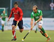 15 March 2012; Timothy Cockram, Ireland, in action against Andres Fuenzalida, Chile. Men’s 2012 Olympic Qualifying Tournament, Ireland v Chile, National Hockey Stadium, UCD, Belfield, Dublin. Picture credit: Barry Cregg / SPORTSFILE