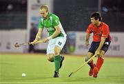 15 March 2012; Eugene Magee, Ireland, in action against Sven Richter, Chile. Men’s 2012 Olympic Qualifying Tournament, Ireland v Chile, National Hockey Stadium, UCD, Belfield, Dublin. Picture credit: Barry Cregg / SPORTSFILE