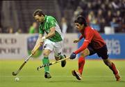15 March 2012; Michael Darling, Ireland, in action against Juan Pablo Purcell, Chile. Men’s 2012 Olympic Qualifying Tournament, Ireland v Chile, National Hockey Stadium, UCD, Belfield, Dublin. Picture credit: Barry Cregg / SPORTSFILE