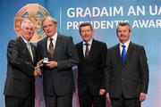 16 March 2012; Dr. Con Murphy, Cork, is presented with his GAA President's Award for 2012 by Uachtarán Cumann Lúthchleas Gael Criostóir Ó Cuana, in the company of AIB Bank General Manager Billy Finn, and Pól Ó Gallchóir, Ceannaái TG4, right, at the GAA Presidents Awards 2012. Dr. Con’s name is synonymous with GAA in Cork and he has been the county’s team doctor since 1976. Apart from the medical side he has been everything from a selector to counselor and confidant for generations of players, and the regard in which he’s held is unrivalled in the game. GAA Presidents Awards 2012, Croke Park, Dublin. Picture credit: Brian Lawless / SPORTSFILE