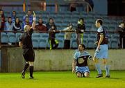 16 March 2012; Referee Rob Rogers shows a second yellow card to Drogheda United's Eric Foley, centre. Airtricity League Premier Division, Drogheda United v Dundalk, Hunky Dory Park, Drogheda, Co. Louth. Photo by Sportsfile