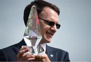 16 July 2017; Trainer Aidan O'Brien lifts the trophy after sending out Spirit of Valor and Ryan Moore to win the Qatar Airways Minstrel Stakes during Day 2 of the Darley Irish Oaks Weekend at the Curragh in Kildare. Photo by Cody Glenn/Sportsfile