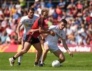 16 July 2017; David Mulgrew of Tyrone in action against Darren O'Hagan of Down during the Ulster GAA Football Senior Championship Final match between Tyrone and Down at St Tiernach's Park in Clones, Co. Monaghan. Photo by Philip Fitzpatrick/Sportsfile