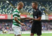 14 July 2017; Leigh Griffiths of Celtic hands over missiles thrown at him during the UEFA Champions League Second Qualifying Round First Leg match between Linfield and Glasgow Celtic at the National Football Stadium in Windsor Park, Belfast. Photo by David Fitzgerald/Sportsfile