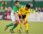 17 March 2012; John Jermyn, Ireland, in action against Fitri Saari Mohd, Malaysia. Men’s 2012 Olympic Qualifying Tournament, Ireland v Malaysia, National Hockey Stadium, UCD, Belfield, Dublin. Picture credit: Barry Cregg / SPORTSFILE