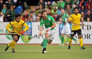 17 March 2012; William Geoffrey McCabe, Ireland, in action against Fitri Mohd Saari, Malaysia. Men’s 2012 Olympic Qualifying Tournament, Ireland v Malaysia, National Hockey Stadium, UCD, Belfield, Dublin. Picture credit: Barry Cregg / SPORTSFILE