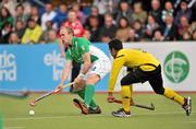 17 March 2012; Eugene Magee, Ireland, in action against Ikmar Mohd Nor Mohd Madzli, Malaysia. Men’s 2012 Olympic Qualifying Tournament, Ireland v Malaysia, National Hockey Stadium, UCD, Belfield, Dublin. Picture credit: Barry Cregg / SPORTSFILE