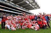 17 March 2012; Loughgiel Shamrocks players and management celebrate with the Tommy Moore Cup. AIB GAA Hurling All-Ireland Senior Club Championship Final, Coolderry, Offaly, v Loughgiel Shamrocks, Antrim. Croke Park, Dublin. Picture credit: Stephen McCarthy / SPORTSFILE