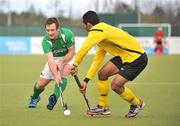 17 March 2012; John Jackson, Ireland, in action against Marhan Mohd Jalil Muhammad, Malaysia. Men’s 2012 Olympic Qualifying Tournament, Ireland v Malaysia, National Hockey Stadium, UCD, Belfield, Dublin. Picture credit: Barry Cregg / SPORTSFILE