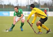 17 March 2012; John Jackson, Ireland, in action against Marhan Mohd Jalil Muhammad, Malaysia. Men’s 2012 Olympic Qualifying Tournament, Ireland v Malaysia, National Hockey Stadium, UCD, Belfield, Dublin. Picture credit: Barry Cregg / SPORTSFILE