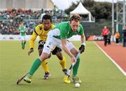 17 March 2012; Andrew McConnell, Ireland, in action against Faizal Saari, Malaysia. Men’s 2012 Olympic Qualifying Tournament, Ireland v Malaysia, National Hockey Stadium, UCD, Belfield, Dublin. Picture credit: Barry Cregg / SPORTSFILE