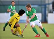 17 March 2012; Ian Sloan, Ireland, in action against Fitri Mohd Saari, Malaysia. Men’s 2012 Olympic Qualifying Tournament, Ireland v Malaysia, National Hockey Stadium, UCD, Belfield, Dublin. Picture credit: Barry Cregg / SPORTSFILE