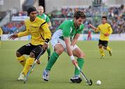 17 March 2012; William Geoffrey McCabe, Ireland, in action against Razie Muhammad Abd Rahim, Malaysia. Men’s 2012 Olympic Qualifying Tournament, Ireland v Malaysia, National Hockey Stadium, UCD, Belfield, Dublin. Picture credit: Barry Cregg / SPORTSFILE