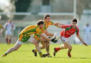18 March 2012; Alan Freeman, Mayo, in action against Anthony Thompson, left, and Ryan Bradley, Donegal. Allianz Football League, Division 1, Round 5, Donegal v Mayo, Fr. Tierney Park, Ballyshannon, Donegal. Picture credit: Oliver McVeigh / SPORTSFILE