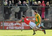 18 March 2012; Michael Murphy, Donegal, scores a point dispite the attempted block of Ger Cafferkey, Mayo. Allianz Football League, Division 1, Round 5, Donegal v Mayo, Fr. Tierney Park, Ballyshannon, Donegal. Picture credit: Oliver McVeigh / SPORTSFILE