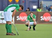 18 March 2012; A dejected William Geoffrey McCabe, right, Ireland, and team captain Ronan Gormley, left, after the game. Men’s 2012 Olympic Qualifying Tournament Final, Ireland v Korea. National Hockey Stadium, UCD, Belfield, Dublin. Picture credit: Barry Cregg / SPORTSFILE