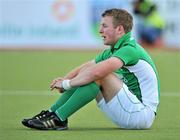 18 March 2012; A dejected Stuart Loughrey, Ireland, after the game. Men’s 2012 Olympic Qualifying Tournament Final, Ireland v Korea. National Hockey Stadium, UCD, Belfield, Dublin. Picture credit: Barry Cregg / SPORTSFILE