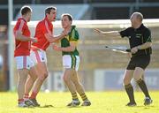 18 March 2012; Darran O'Sullivan, Kerry, during an altercation with Cork players Michael Shields, left, and Graham Canty as linesman Richard Moloney steps in. Allianz Football League, Division 1, Round 5, Cork v Kerry, Pairc Ui Chaoimh, Cork. Picture credit: Stephen McCarthy / SPORTSFILE