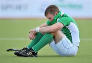 18 March 2012; A dejected Stuart Loughrey, Ireland, after the game. Men’s 2012 Olympic Qualifying Tournament Final, Ireland v Korea. National Hockey Stadium, UCD, Belfield, Dublin. Picture credit: Barry Cregg / SPORTSFILE