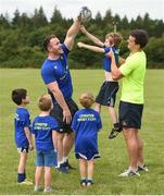 18 July 2017; Peter Dooley and Tom Daly of Leinster Rugby came out to the Bank of Ireland Summer Camp to meet up with some local young rugby talent at Portaloise RFC. Pictured are Peter Dooley, and Tom Daly, helping out Loran Hayes, age 6, at Portlaoise RFC, in Co. Laois. Photo by Seb Daly/Sportsfile