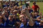 18 July 2017; Leinster's Cathal Marsh takes a selfie with participants during Bank of Ireland Leinster Rugby Summer Camp in Seapoint. Photo by Piaras Ó Mídheach/Sportsfile