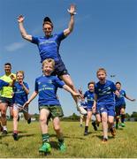 18 July 2017; Leinster's Cathal Marsh, centre, and Mick Kearney with participants during the Bank of Ireland Leinster Rugby Summer Camp in Seapoint. Photo by Piaras Ó Mídheach/Sportsfile