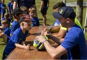 18 July 2017; Ben Ahston, age 6, gets an autograph from Leinster's Cathal Marsh during Bank of Ireland Leinster Rugby Summer Camp in Seapoint. Photo by Piaras Ó Mídheach/Sportsfile