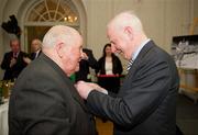 9 March 2012; Dr. Pat Hickey, President of the OCI, with Paddy Condon, swimming team manager, a member of the 1948 Olympic Team, and his Olympic Medal of Honour. Farmleigh House, Phoenix Park, Dublin 15. Picture credit: Ray McManus / SPORTSFILE