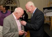 9 March 2012; Dr. Pat Hickey, President of the OCI, with Brendan O'Kelly, football, left, a member of the 1948 Olympic Team, and his Olympic Medal of Honour. Farmleigh House, Phoenix Park, Dublin 15. Picture credit: Ray McManus / SPORTSFILE