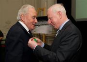 9 March 2012; Dr. Pat Hickey, President of the OCI, presents Morgan McElligott, rowing, left, a member of the 1948 Olympic Team, with his Olympic Medal of Honour. Farmleigh House, Phoenix Park, Dublin 15. Picture credit: Ray McManus / SPORTSFILE