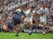14 July 2002; Alan Brogan of Dublin runs clear of Ken Doyle and Ronan Sweeney, right, of Kildare during the Bank of Ireland Leinster Senior Football Championship Final match between Dublin and Kildare at Croke Park in Dublin. Photo by Ray McManus/Sportsfile