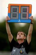 13 July 2002; The fourth official holds up the electronic board for extra minutes at the end of normal time during the eircom League Premier Division match between Longford Town and Bohemians at Flancare Park in Longford. Photo by David Maher/Sportsfile