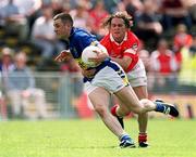 14 July 2002; Niall Fitzgerald of Tipperary in action against Alan Cronin of Cork during the Bank of Ireland Munster Senior Football Championship Final match between Cork and Tipperary at Semple Stadium in Thurles, Tipperary. Photo by Brendan Moran/Sportsfile