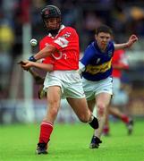30 June 2002; Richard Butler of Cork in action against Lee Shanahan of Tipperary during the Munster Minor Hurling Championship Final match between Cork and Tipperary at Páirc Uí Chaoimh in Cork. Photo by Ray McManus/Sportsfile