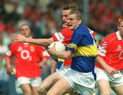 14 July 2002; Kevin Mulryan of Tipperary in action against Nicholas Murphy of Cork during the Bank of Ireland Munster Senior Football Championship Final match between Cork and Tipperary at Semple Stadium in Thurles, Tipperary. Photo by Pat Murphy/Sportsfile